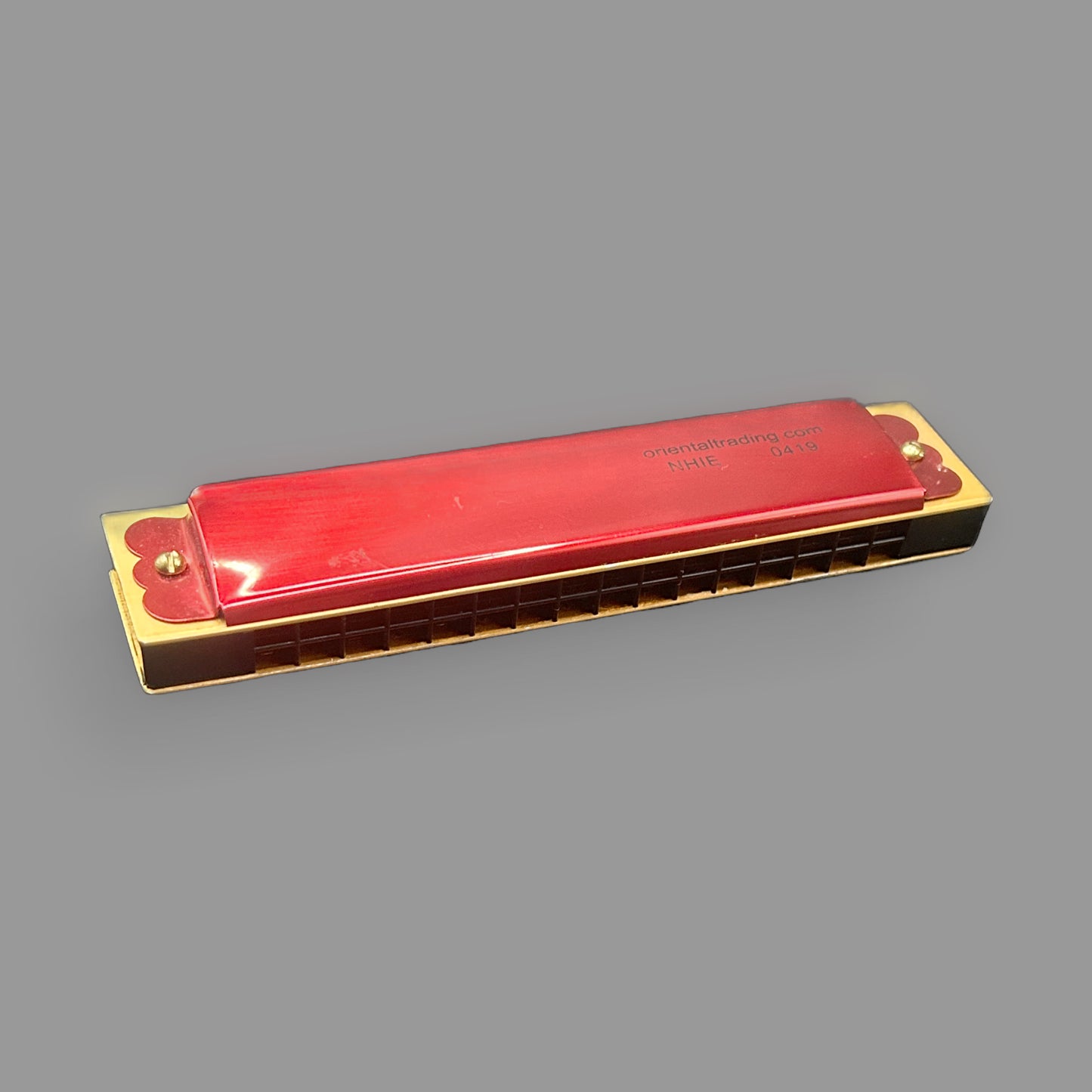 Vintage Red 10-Hole Harmonica — Bright Crimson, Novelty Format — detail view