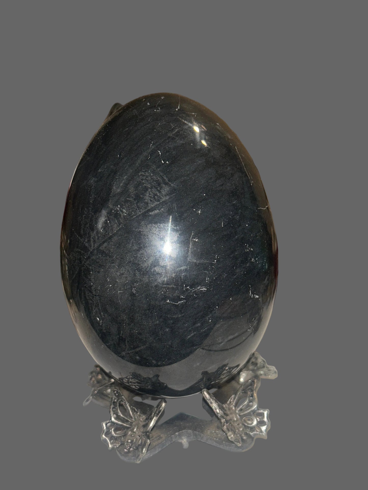 Void Mirror — Black Obsidian Egg Carving — detail view