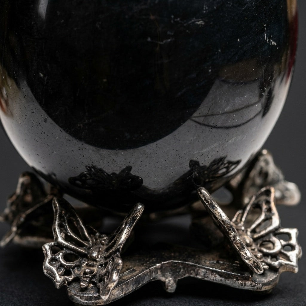 Void Mirror — Black Obsidian Egg Carving — detail view
