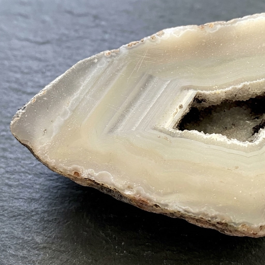 Sliced Agate Geode — Cream & Ivory Banding, Dark Druzy Center, 136g — detail view