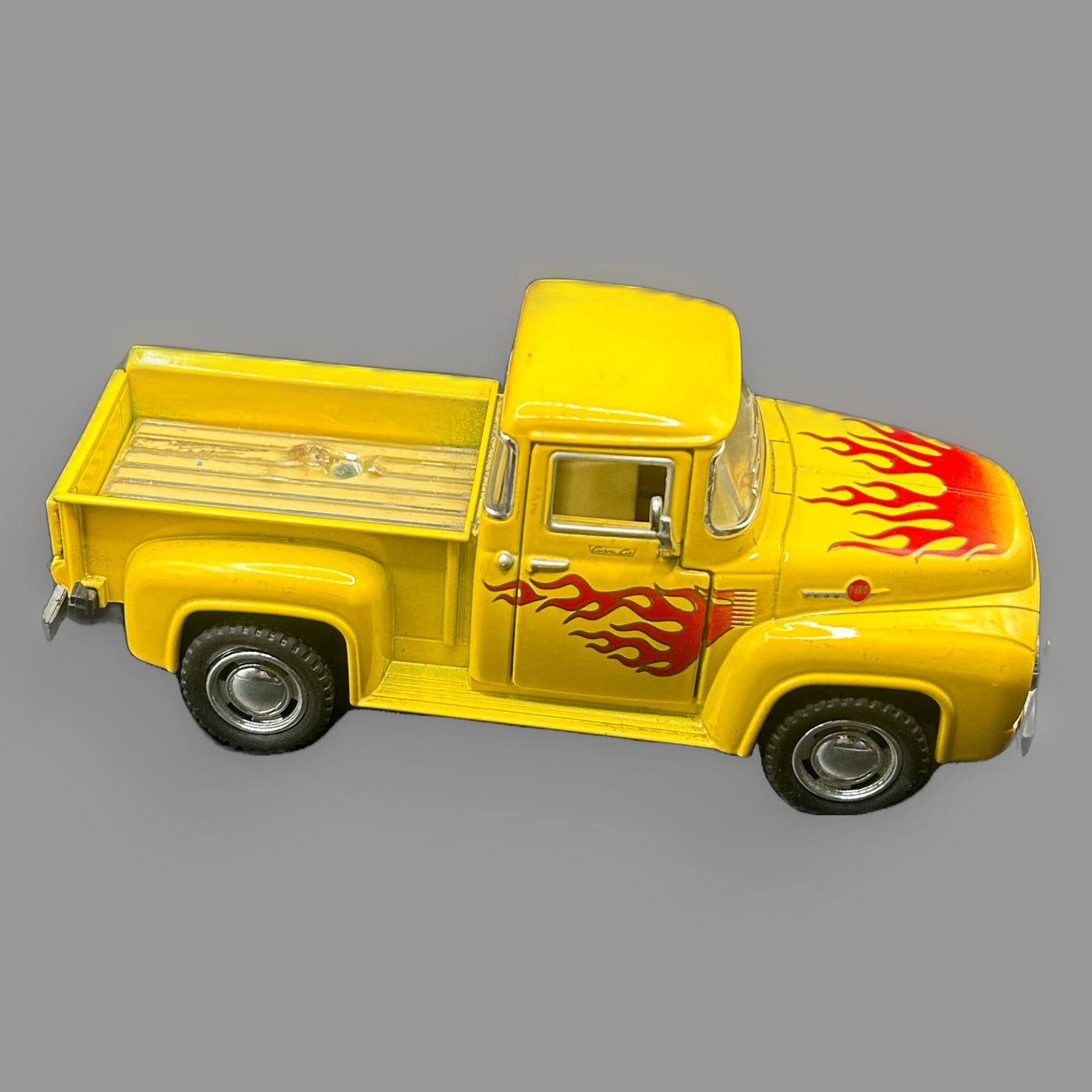 Jada Toys 1956 Ford F-100 Pickup Diecast — Yellow with Flame Detail, Wood-Look Bed — detail view