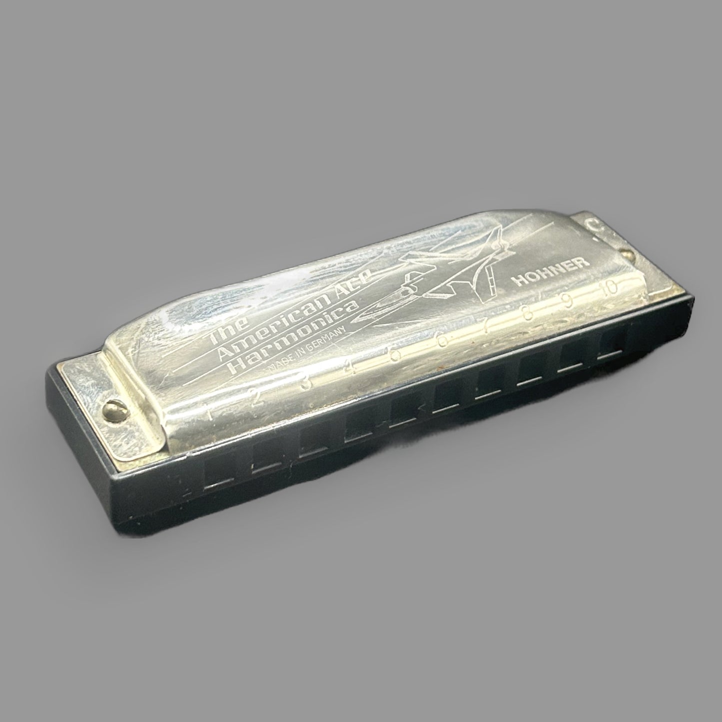Vintage Hohner American Ace Harmonica — Key of C with Airplane Engraved Cover — detail view