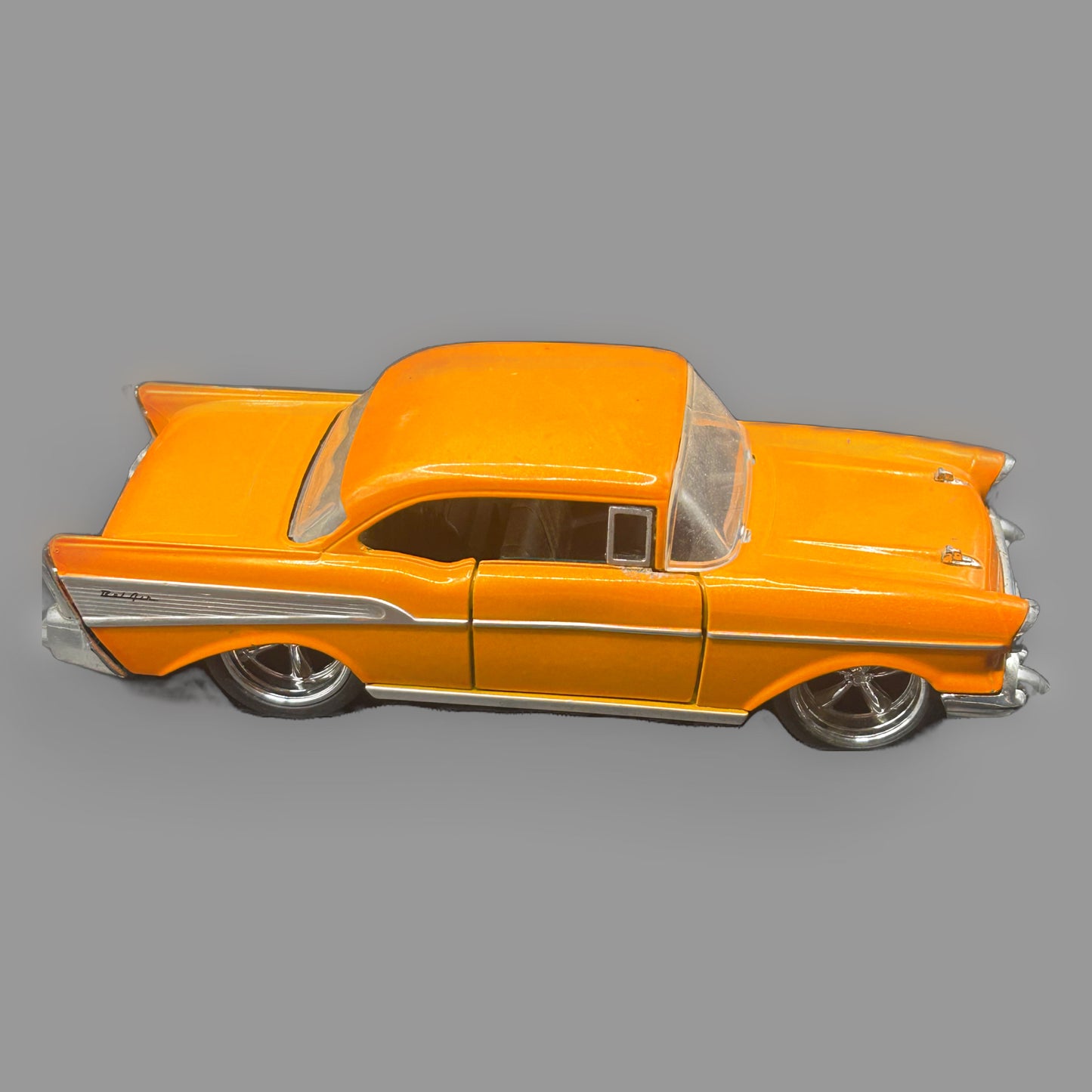 Jada Toys 1957 Chevrolet Bel Air Diecast — Bigtime Muscle 1:24, Orange with Chrome — main view