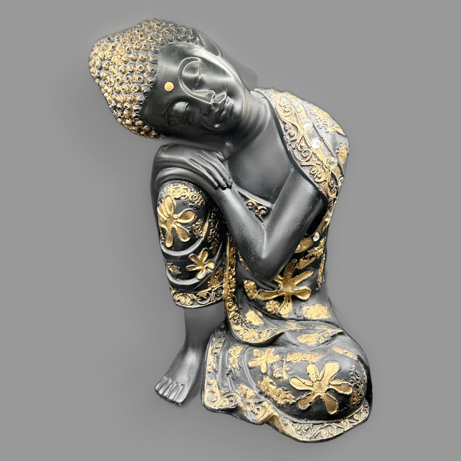 Black & Gold Resting Buddha Statue with Floral Robe Detail — detail view