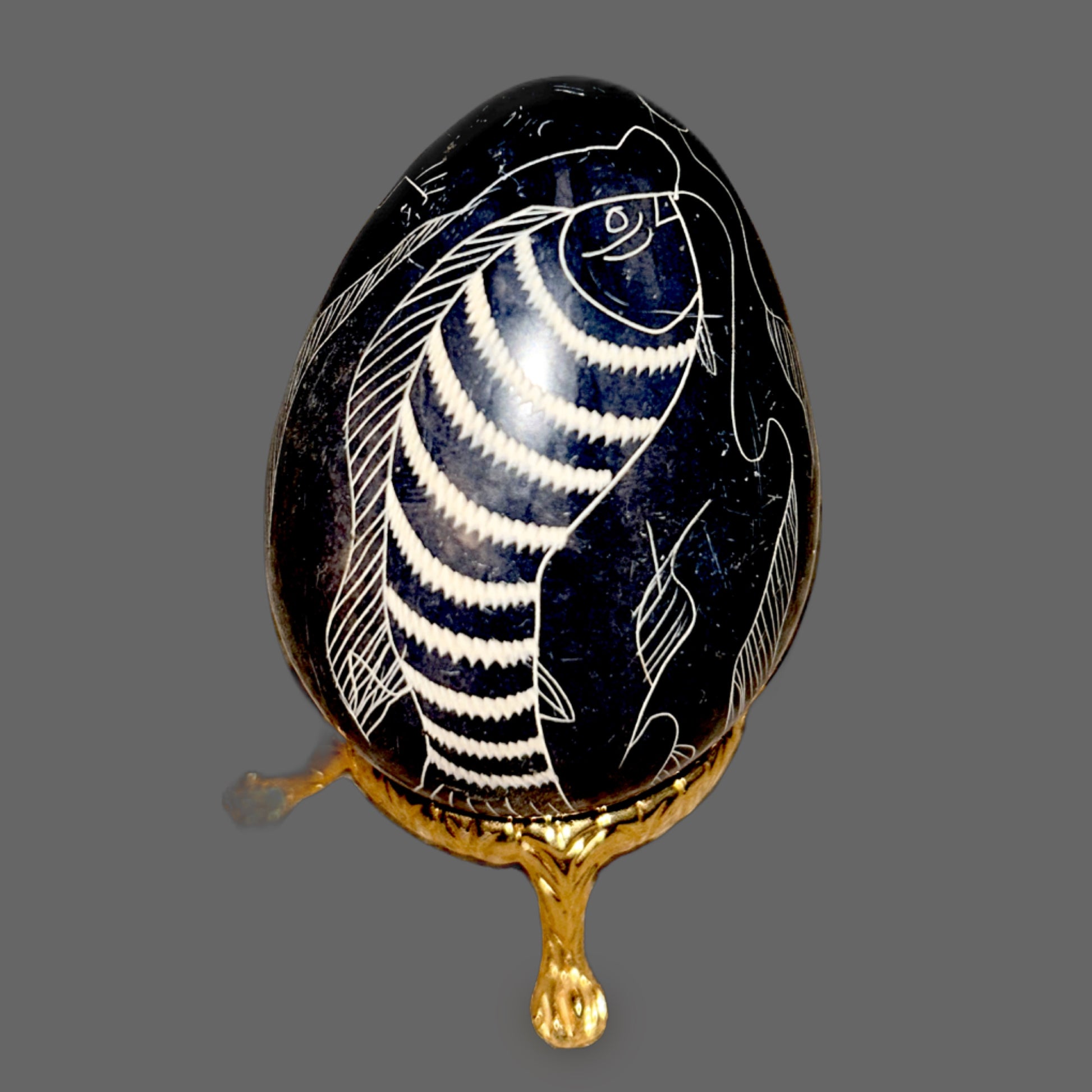 Black Stone Egg with Engraved Fish — Incised White-Fill Carving, 201g — detail view